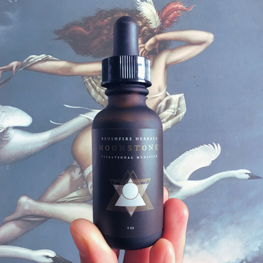 Moonstone Essence in front of painting